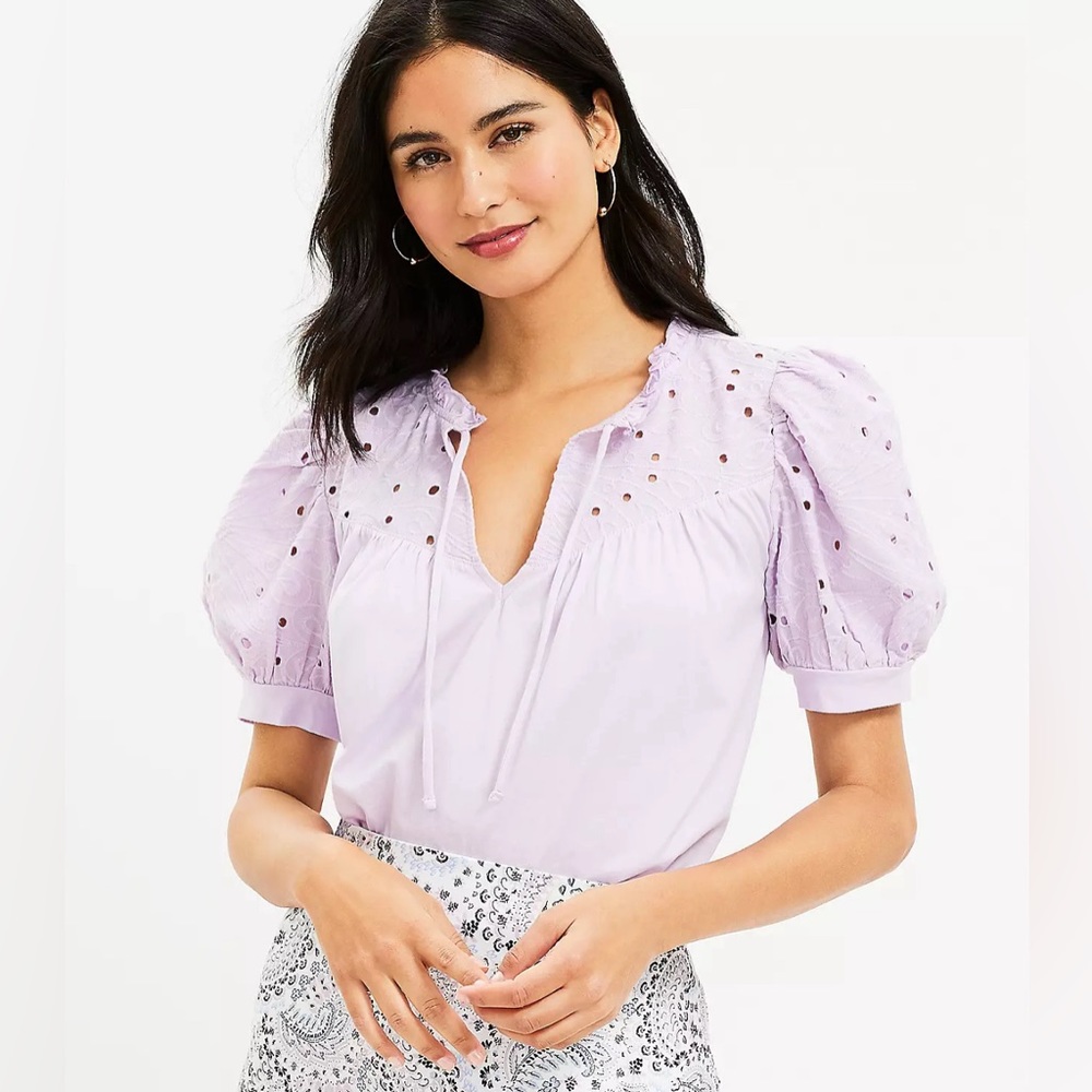 NWT A great spring t-shirt with eyelet puff sleeve detail.